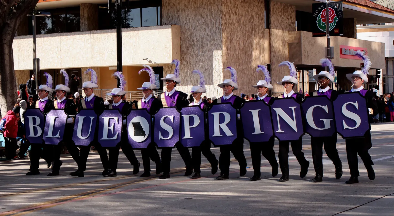 Marching band carrying Blue Springs letter shields in a Missouri parade