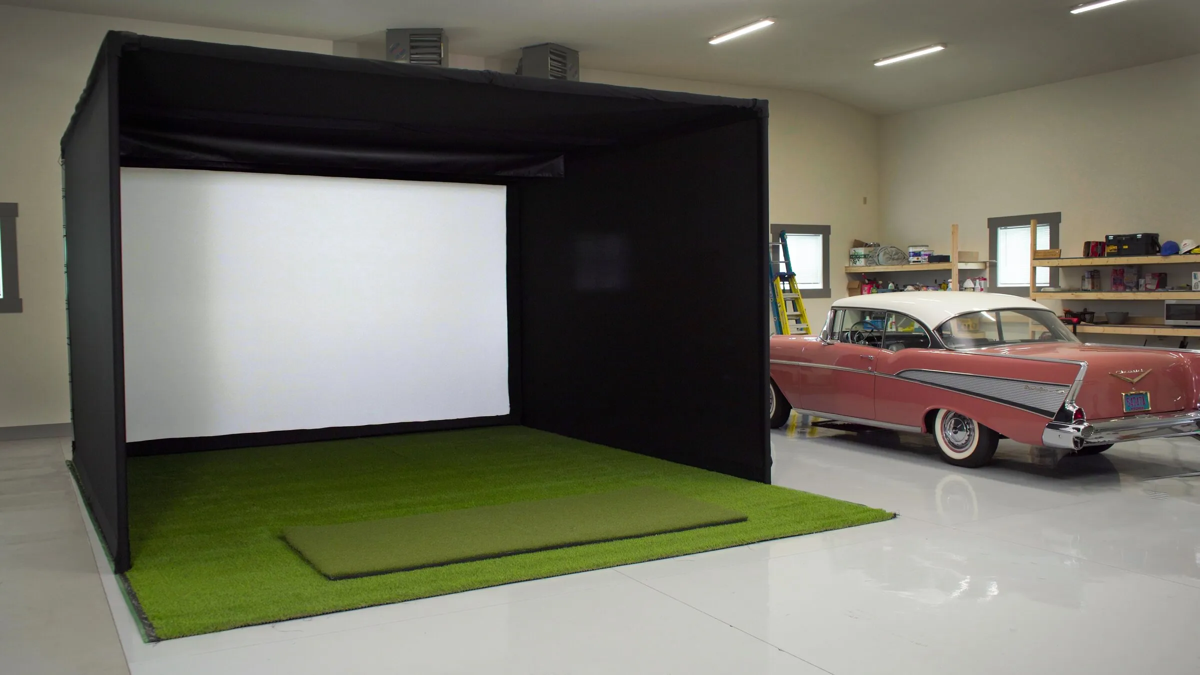 Garage set up as a golf simulator bay