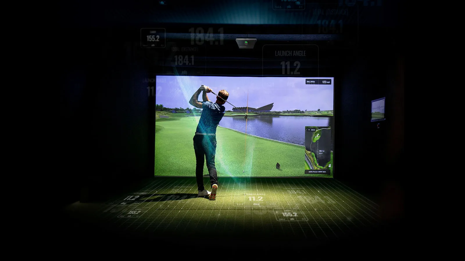 Golfer playing on an indoor golf simulator