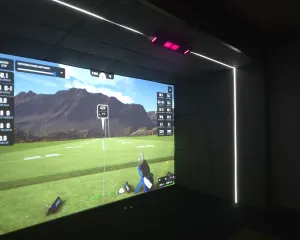Finished and calibrated golf simulator bay with LED lighting and overhead launch monitor