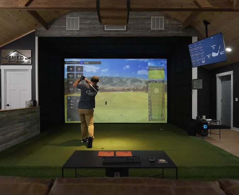 Finished golf simulator room running the software